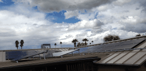 Off-grid solar panels on metal and flat roof in the city with SRP
