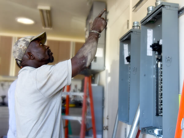 man planning out solar insulation