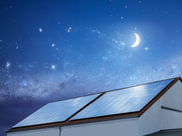 House at night with a solar panel