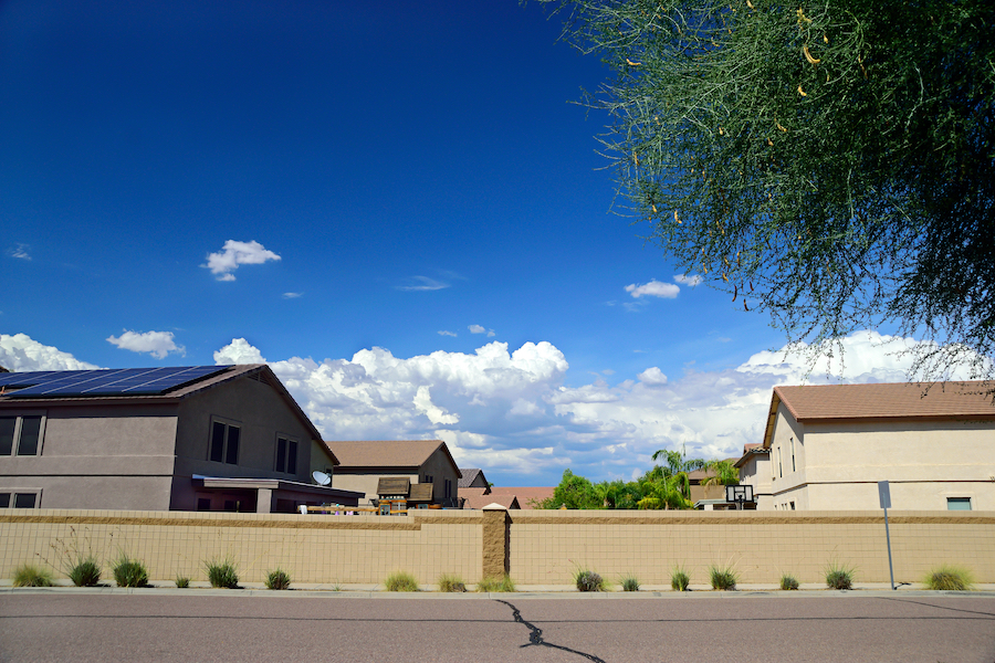skyline of northern phoenix with a house with solar panels