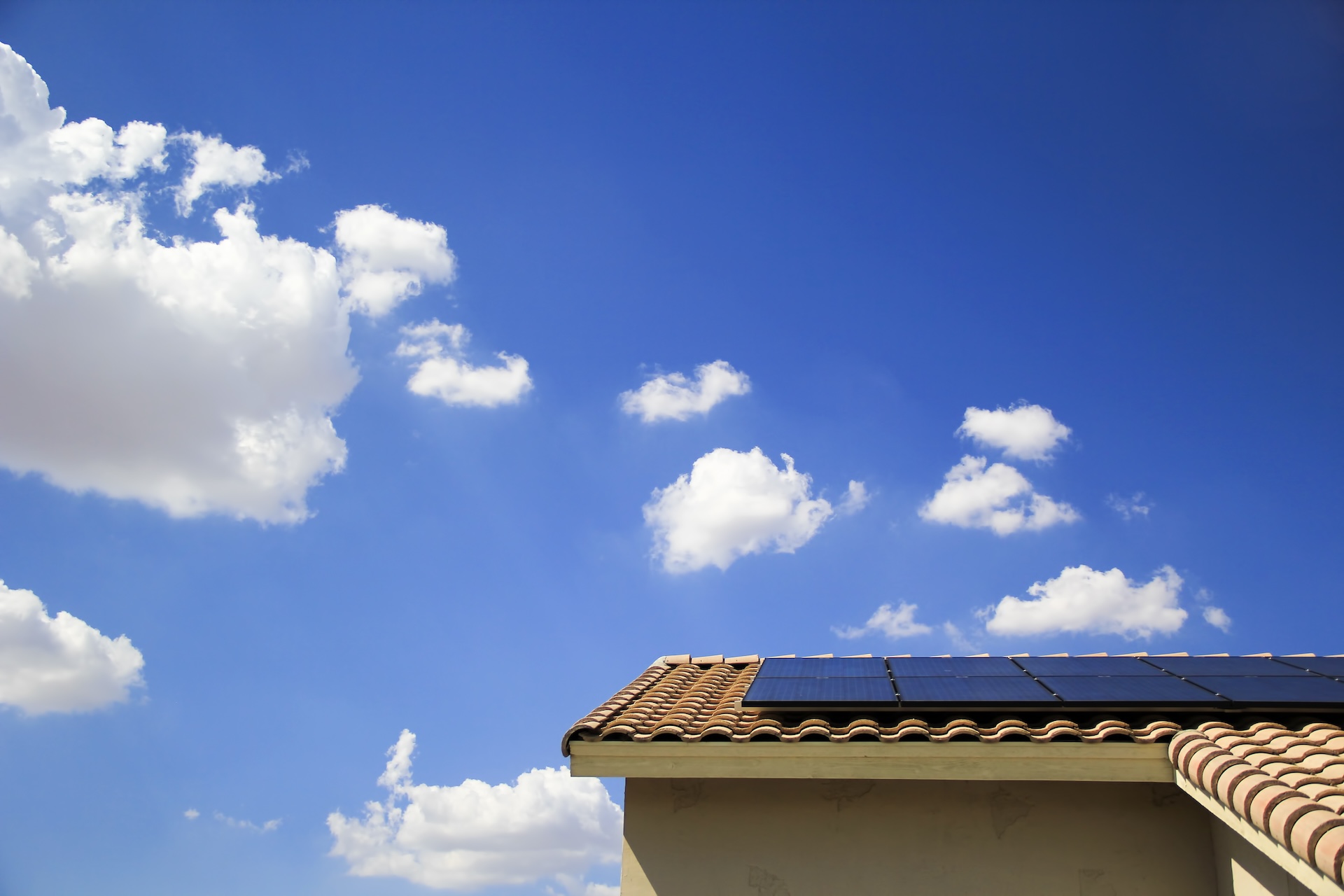 New solar array atop southwestern home with blue skies in background