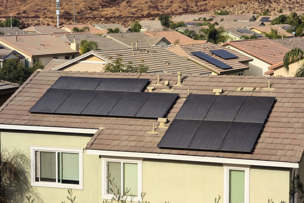 Solar panel array installed on the roofs of two residences
