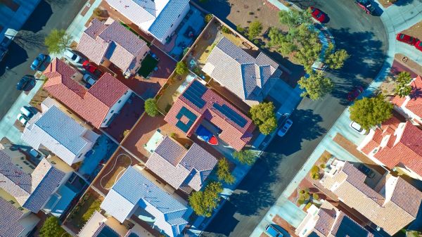 Aerial Top Down of Sustainable Suburban Homes with Solar Panels