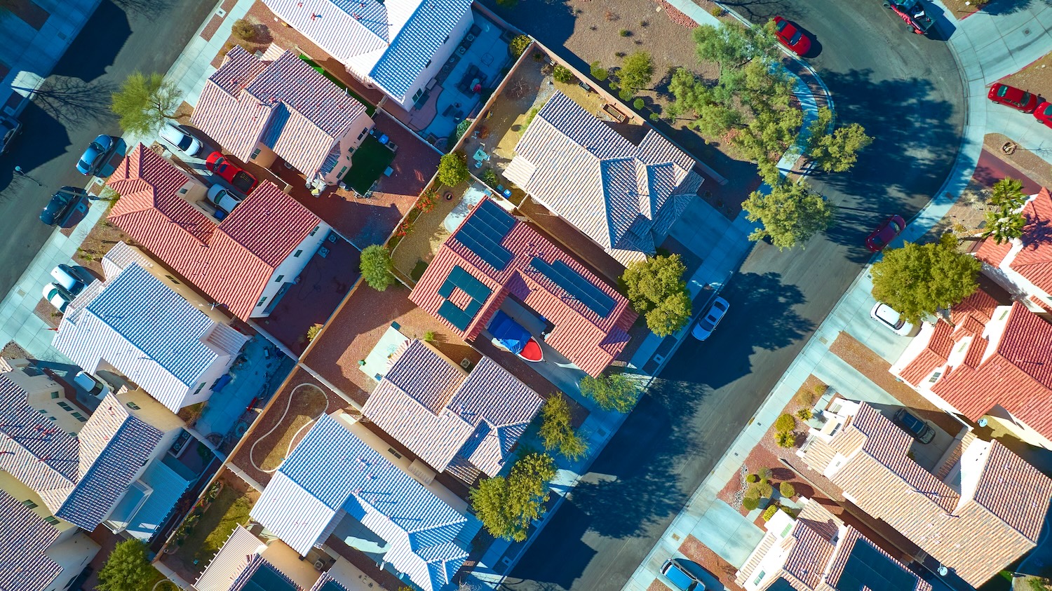 Aerial Top Down of Sustainable Suburban Homes with Solar Panels